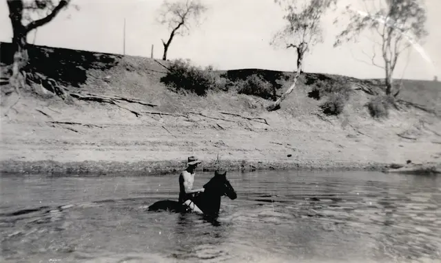 Bill McBratney riding Addis through the Murrumbidgee