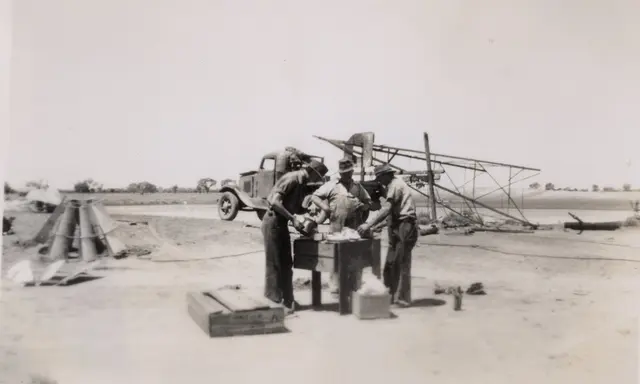 Bill McBratney with Saxy and Bernie, repairing the mill, 1948
